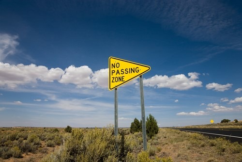 A no passing zone sign.
