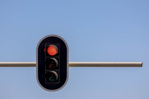 A red traffic light signaling stop.